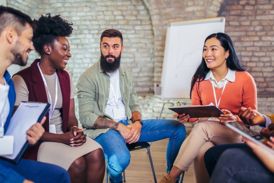 A group of professionals engaging in a team discussion, reflecting Beacon Hill’s collaborative culture and career development opportunities.