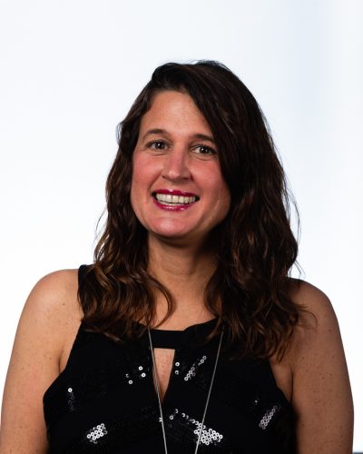 Portrait of Heather Harrold Carpenito, Senior Division Director at Beacon Hill Associates, a division of Beacon Hill, a leading staffing and consultation firm. Heather leads recruitment and client strategy efforts, specializing in administrative and corporate staffing solutions for businesses across various industries.