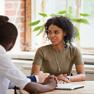 HR team having a collaborative staffing discussion with a job candidate