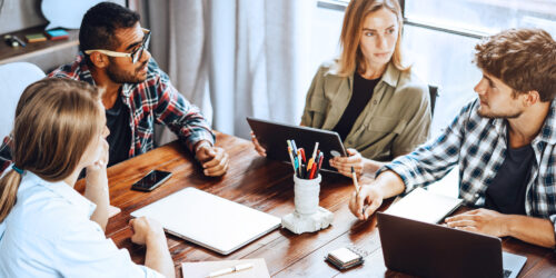 A team of technology professionals collaborates during a creative strategy session, surrounded by laptops, tablets, and notes. This image highlights the innovative, agile workforce provided through our IT consulting and staffing solutions—bringing together developers, project managers, and tech experts to power digital transformation and business growth.