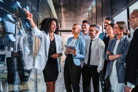 Business team collaborating and reviewing ideas during a strategy meeting, symbolizing the innovation and agility MSPs bring to contingent workforce management.