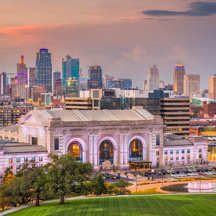 Kansas City, Missouri skyline at sunset with glowing buildings and vibrant skies, showcasing the city’s growing demand for temp agency services.