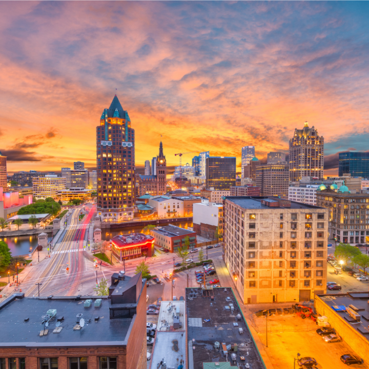 Downtown Milwaukee skyline at sunset, representing Milwaukee's staffing agency services.