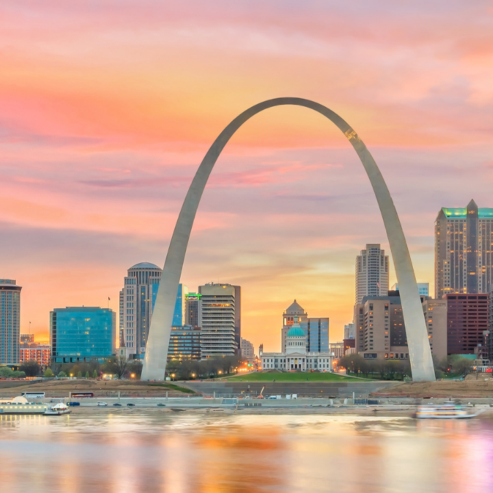 Downtown St. Louis, Missouri skyline featuring the Gateway Arch at sunset, symbolizing the city's vibrant job market and temp agency presence.